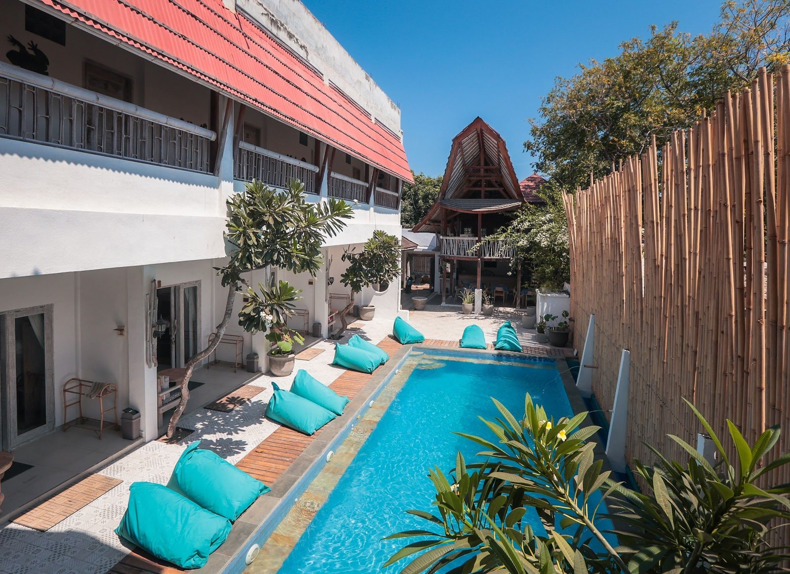 The garden and pool at The 5 Brothers Hotel