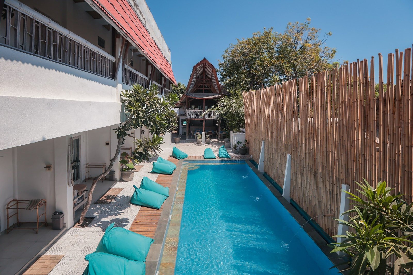 A room at The 5 Brothers Hotel opening onto the pool